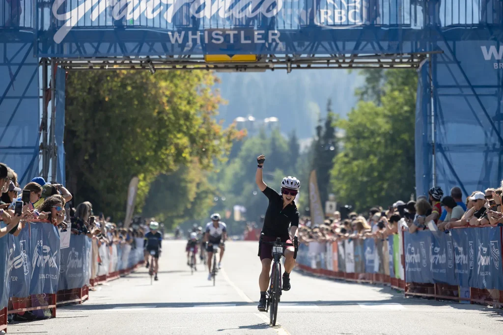 Whistler GranFondo Finisher with their hands in the air