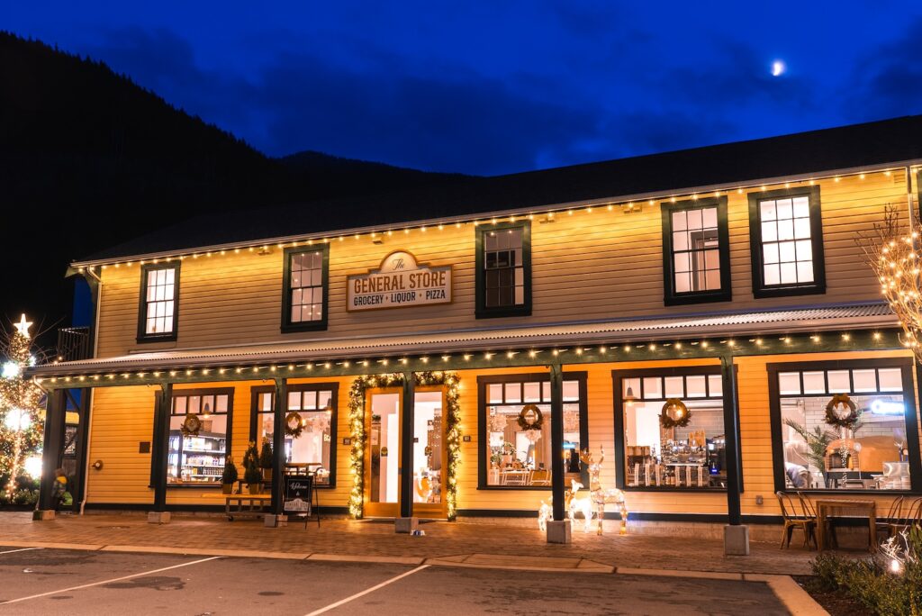 The exterior of a historic retail store at twilight