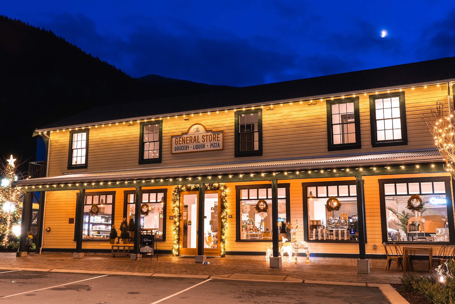 The exterior of a historic retail store at twilight