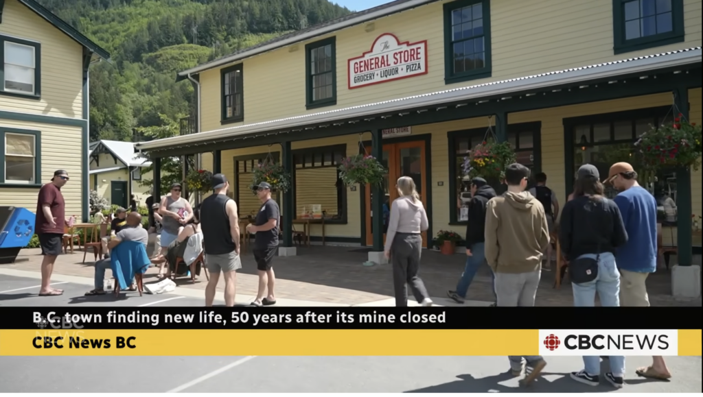 A still from a CBC News video showing a group of people standing outside a country general store